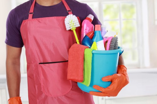 Professional cleaners maintaining a modern Canary Wharf office interior