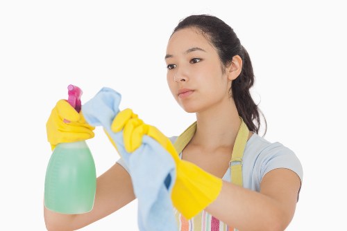 Airbnb cleaner preparing a modern Canary Wharf apartment for guests
