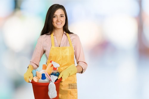 Professional cleaning team using PPE and safety procedures